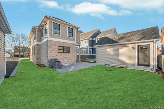 a front view of house with a garden