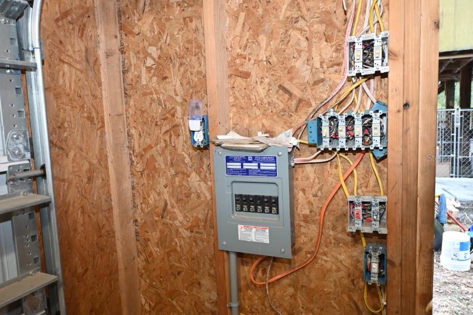 39716 Tworut Road Webster, FL 33597 - Photo 24 of 36 a street sign on a brick wall