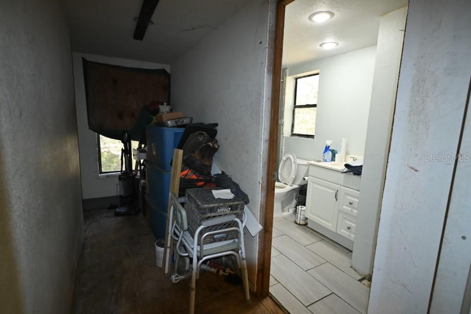 39716 Tworut Road Webster, FL 33597 - Photo 10 of 36 a view of walk in closet with clothes and shoes
