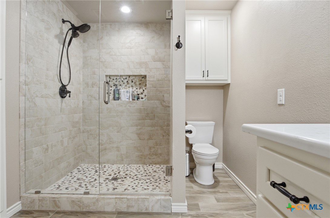 642 Phantom Rider Trail Spring Branch, TX 78070 - Photo 40 of 41 a bathroom with a toilet and a shower