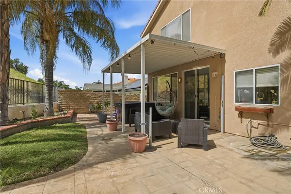 a view of a house with backyard porch and patio