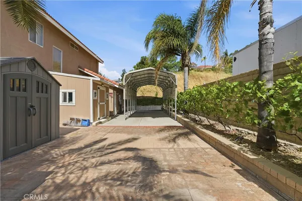 a front view of a house with a garden and yard