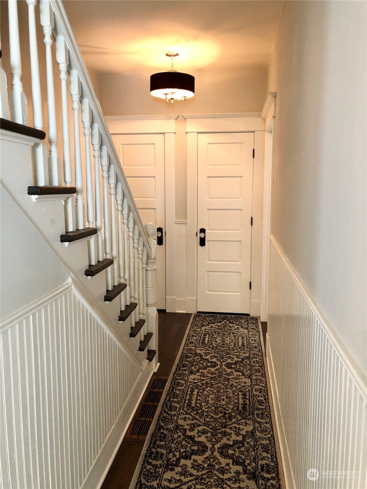 375 Southeast Bush Street Issaquah, WA 98027 - Photo 20 of 40 a view of a hallway with wooden floor and staircase