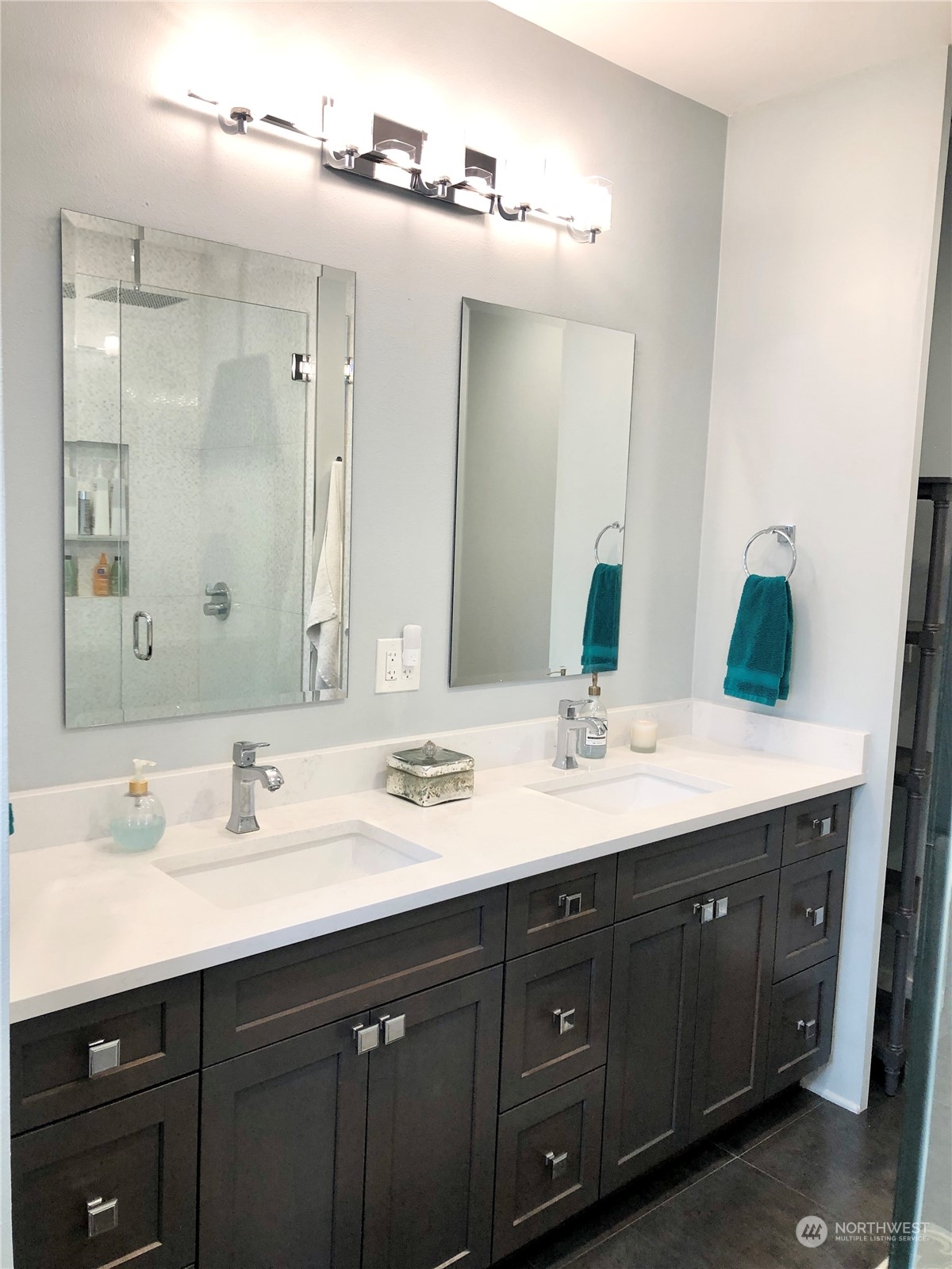 375 Southeast Bush Street Issaquah, WA 98027 - Photo 25 of 40 a bathroom with a double vanity sink and a mirror