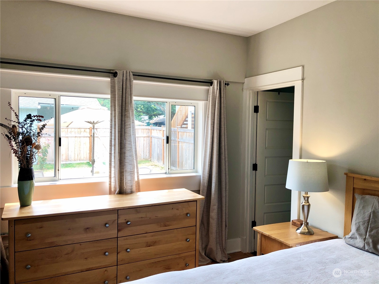 375 Southeast Bush Street Issaquah, WA 98027 - Photo 27 of 40 a bedroom with a bed and a large window