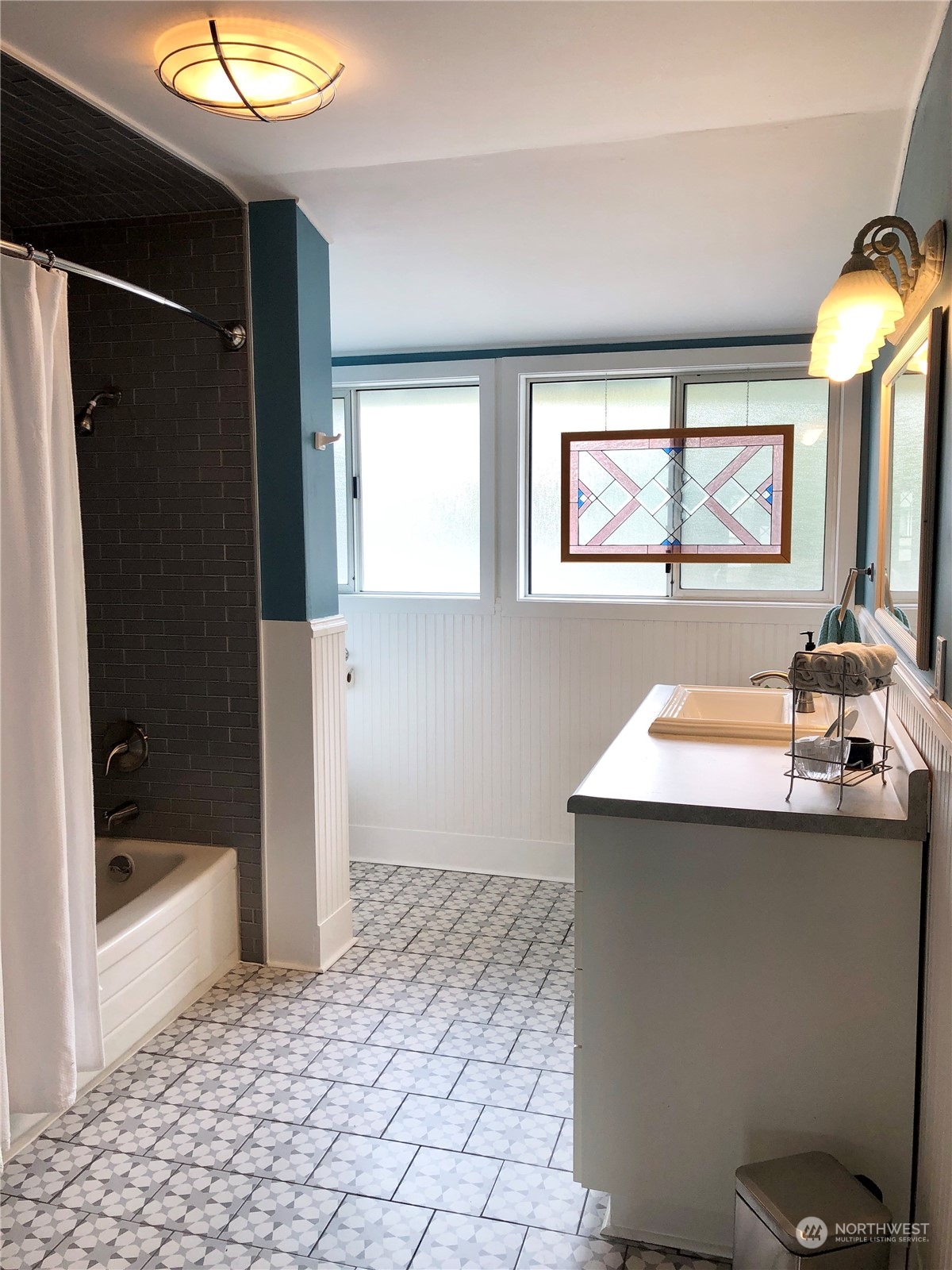 375 Southeast Bush Street Issaquah, WA 98027 - Photo 31 of 40 a bathroom with a sink a toilet and shower