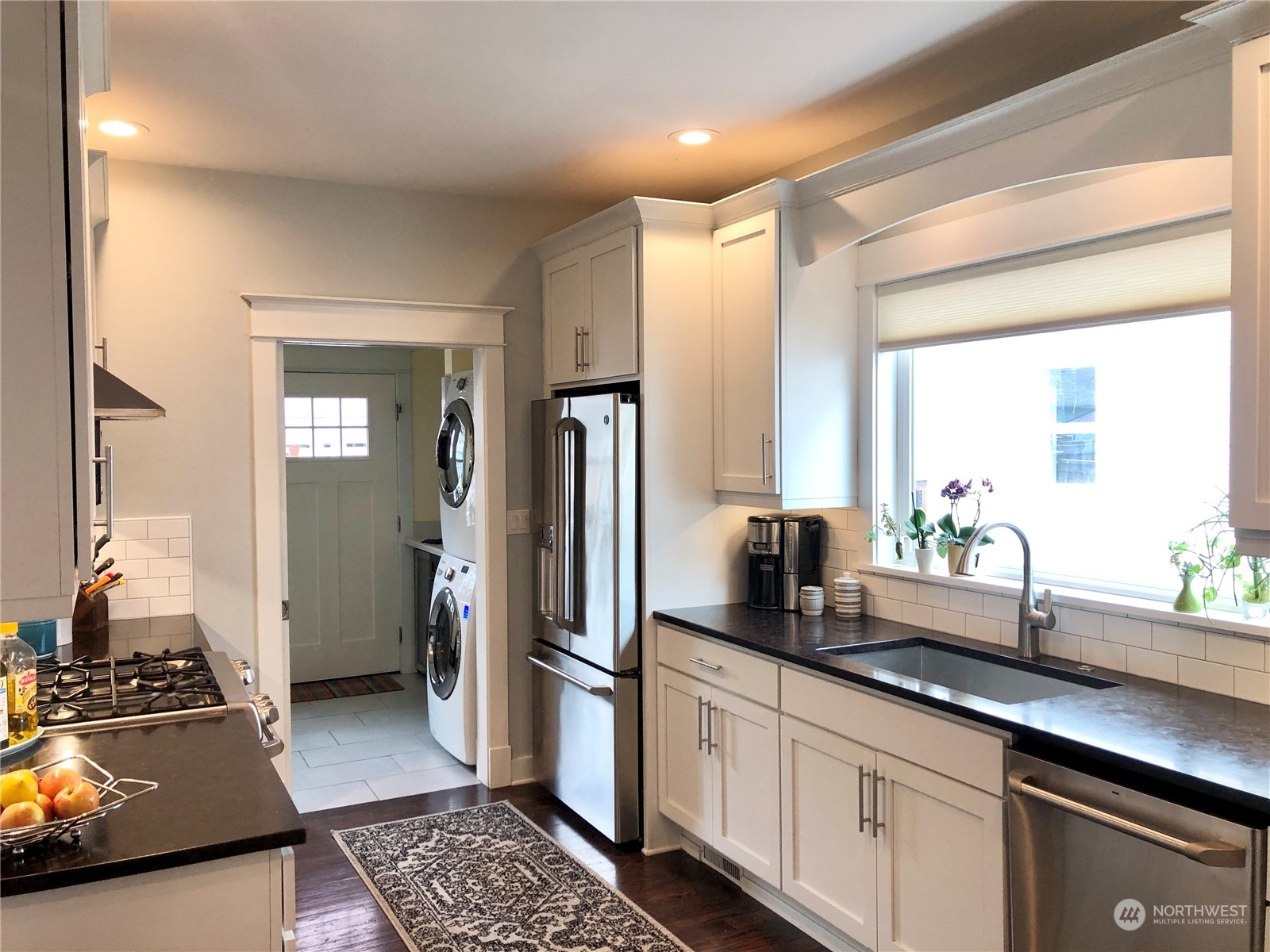 375 Southeast Bush Street Issaquah, WA 98027 - Photo 10 of 40 a kitchen with a refrigerator and a sink