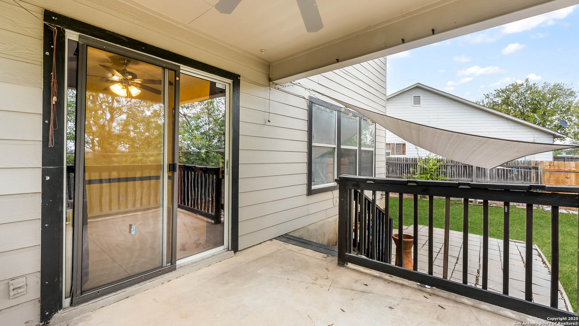 9406 San Fidel Rio San Antonio, TX 78245 - Photo 19 of 21 a view of a porch with a floor to ceiling window