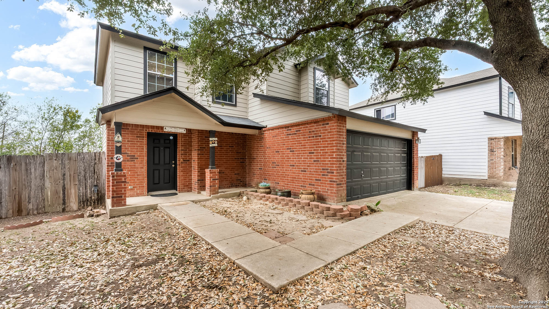 9406 San Fidel Rio San Antonio, TX 78245 - Photo 20 of 21 a front view of a house with a yard and garage