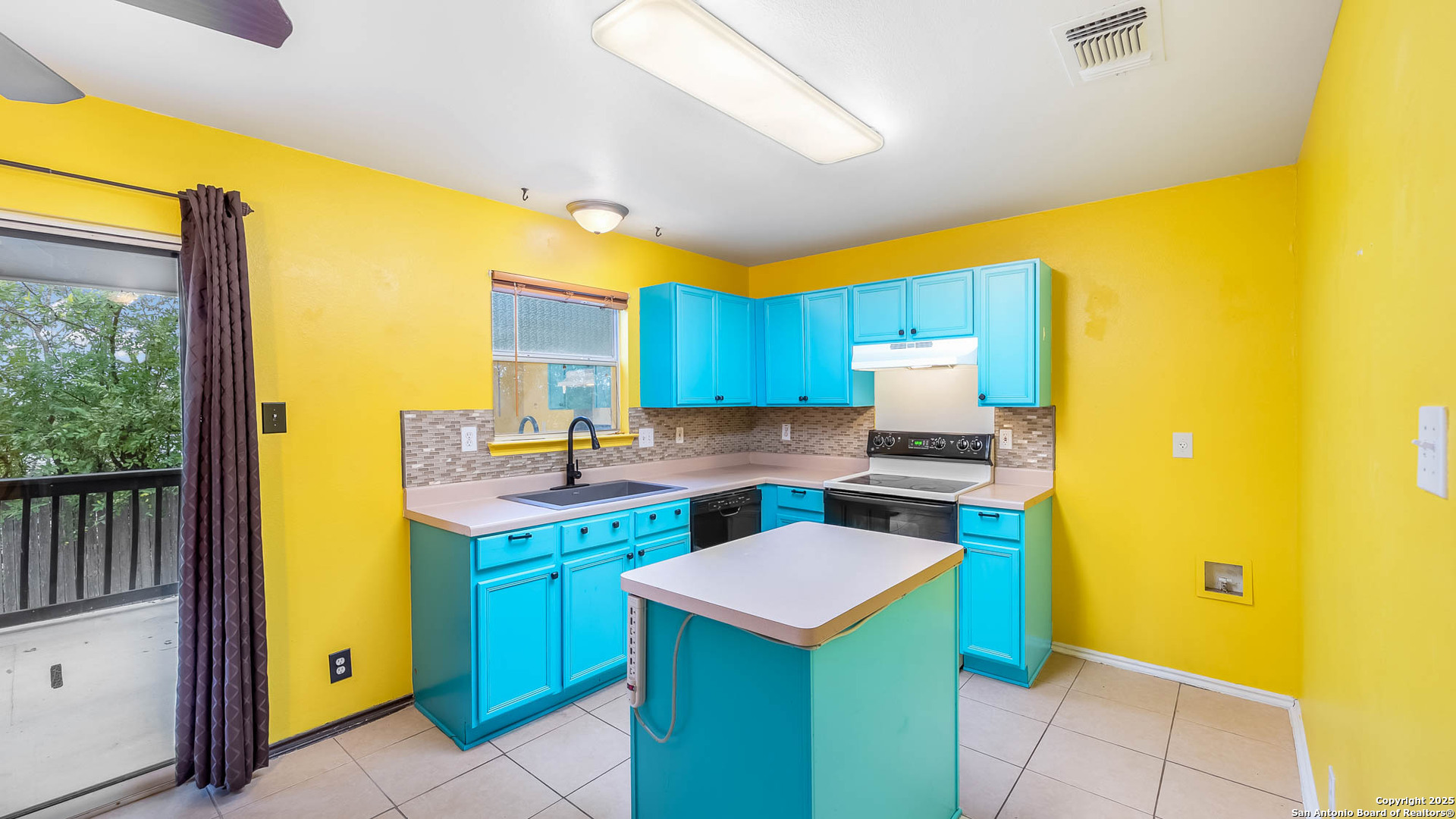 9406 San Fidel Rio San Antonio, TX 78245 - Photo 6 of 23 a kitchen that has a sink and a stove