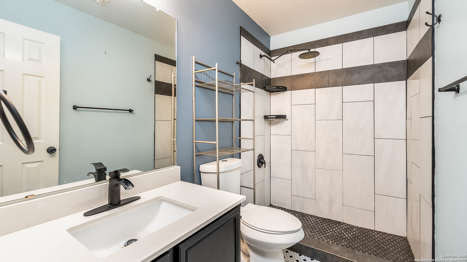 9406 San Fidel Rio San Antonio, TX 78245 - Photo 7 of 21 a bathroom with a sink toilet and shower