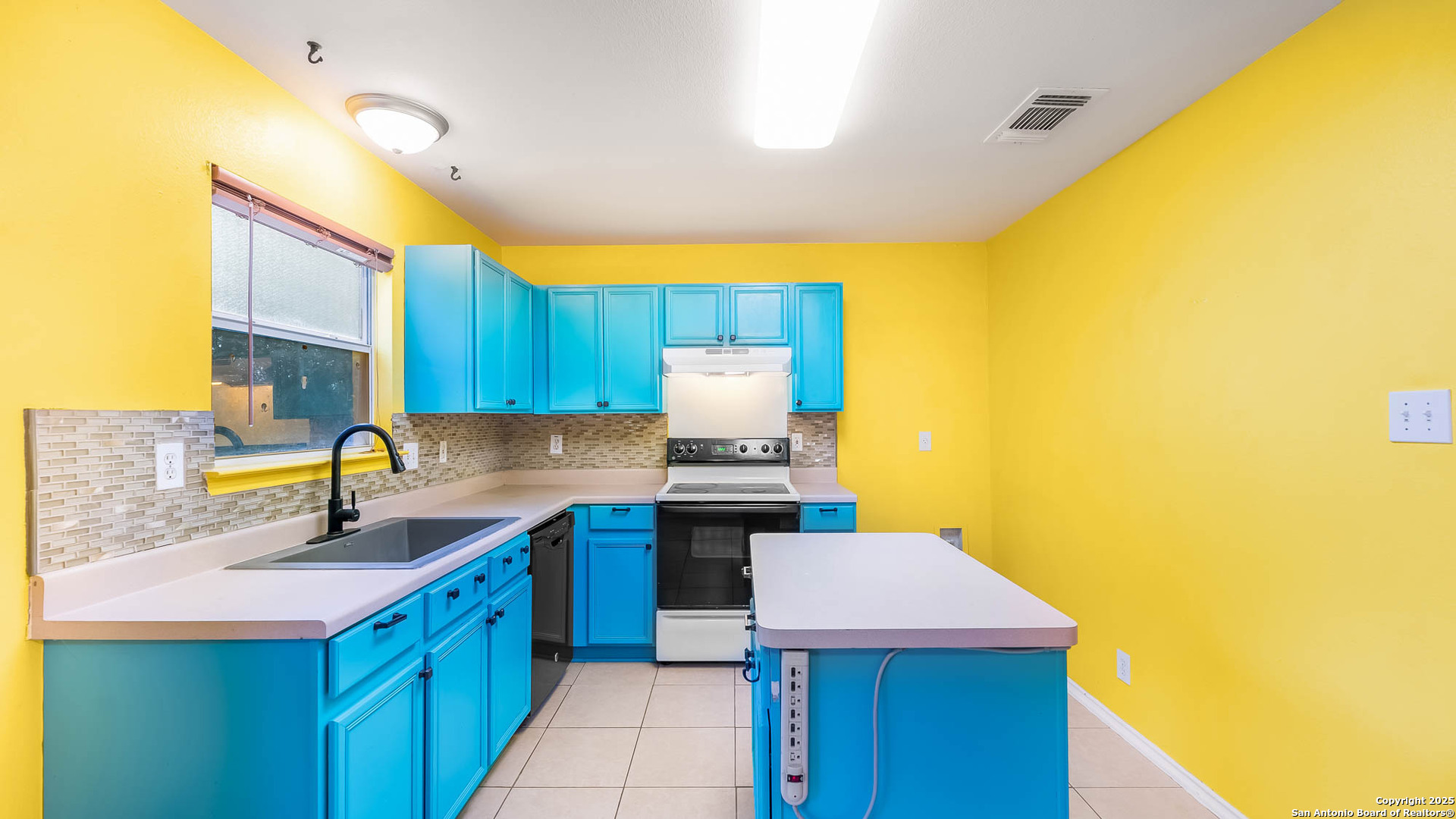 9406 San Fidel Rio San Antonio, TX 78245 - Photo 7 of 23 a kitchen that has a sink and a stove in it