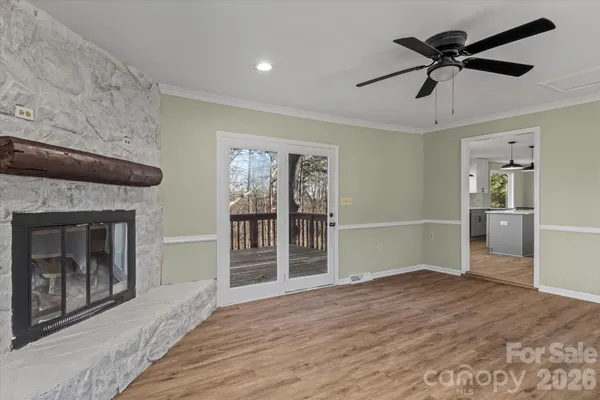 a bedroom with furniture fireplace and a window