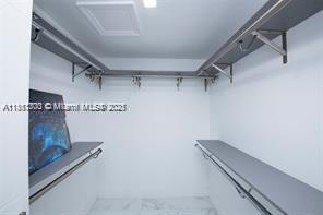 455 Northeast 210th Terrace Miami, FL 33179 - Photo 12 of 25 a view of a room with racks on the wall