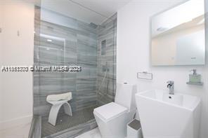 455 Northeast 210th Terrace Miami, FL 33179 - Photo 13 of 25 a bathroom with a sink toilet and shower