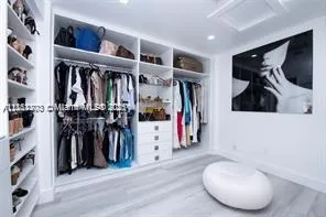 a bathroom with a shower a toilet and sink