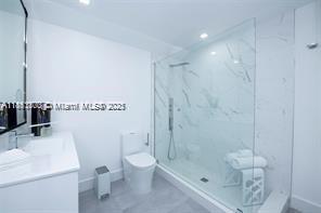 455 Northeast 210th Terrace Miami, FL 33179 - Photo 20 of 25 a bathroom with a shower a toilet and sink