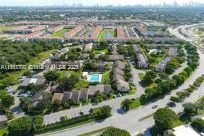 an aerial view of a house with garden space and street view