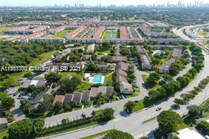 455 Northeast 210th Terrace Miami, FL 33179 - Photo 24 of 25 an aerial view of residential houses with outdoor space and parking