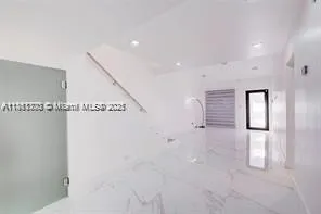 a view of a hallway with stairs