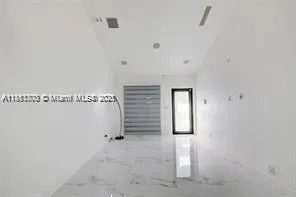 a kitchen with stainless steel appliances kitchen island granite countertop a sink and cabinets