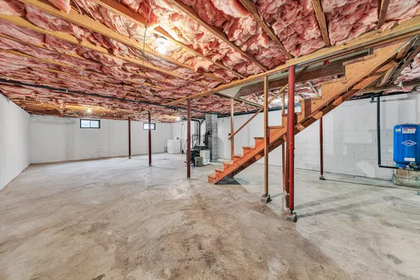 a view of an empty room with a small yard