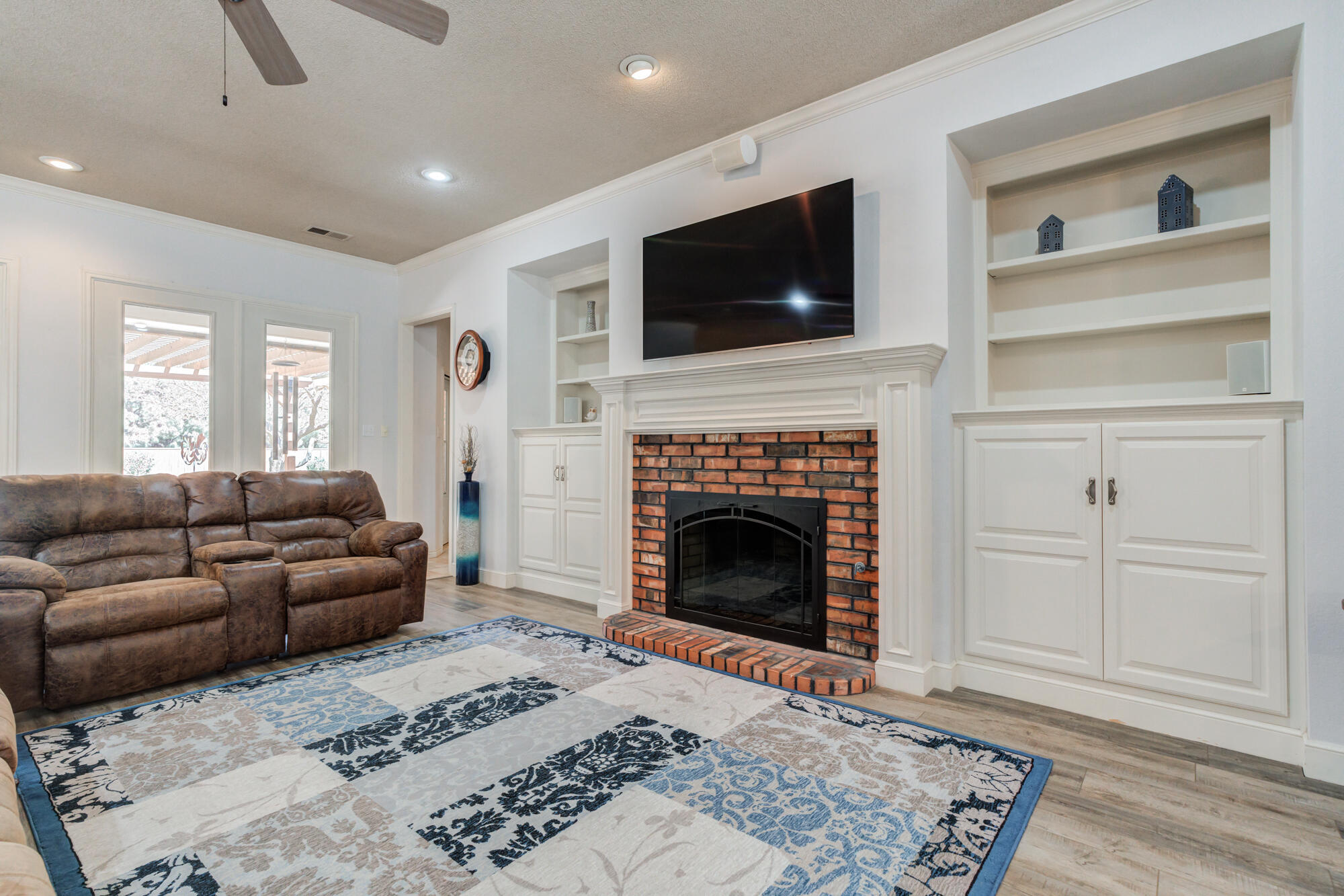 3522 156th Street Lubbock, TX 79423 - Photo 16 of 75 a living room with furniture and a fireplace