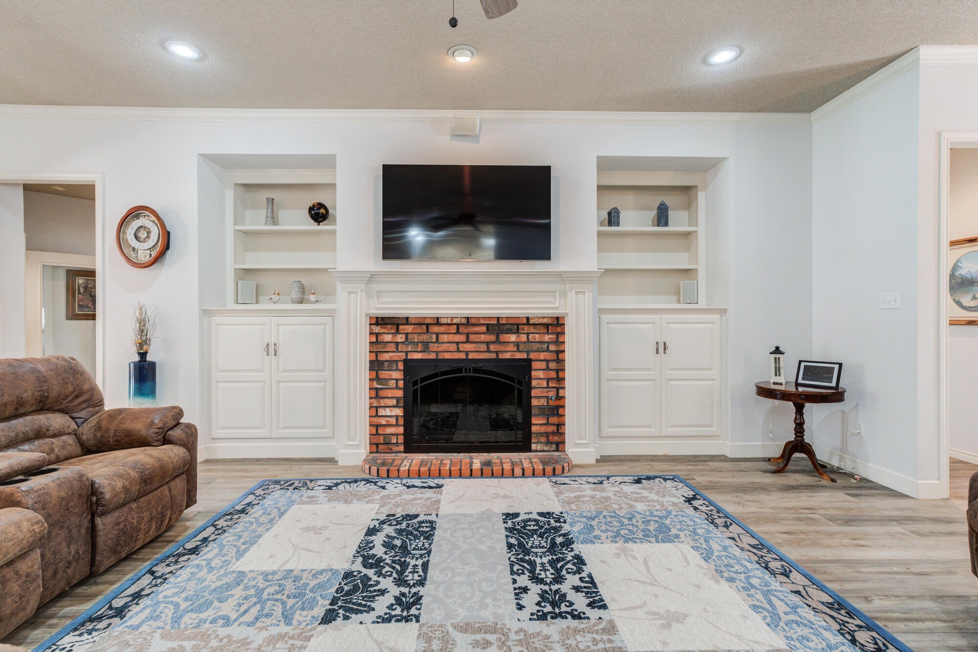 3522 156th Street Lubbock, TX 79423 - Photo 17 of 75 a living room with furniture and a fireplace