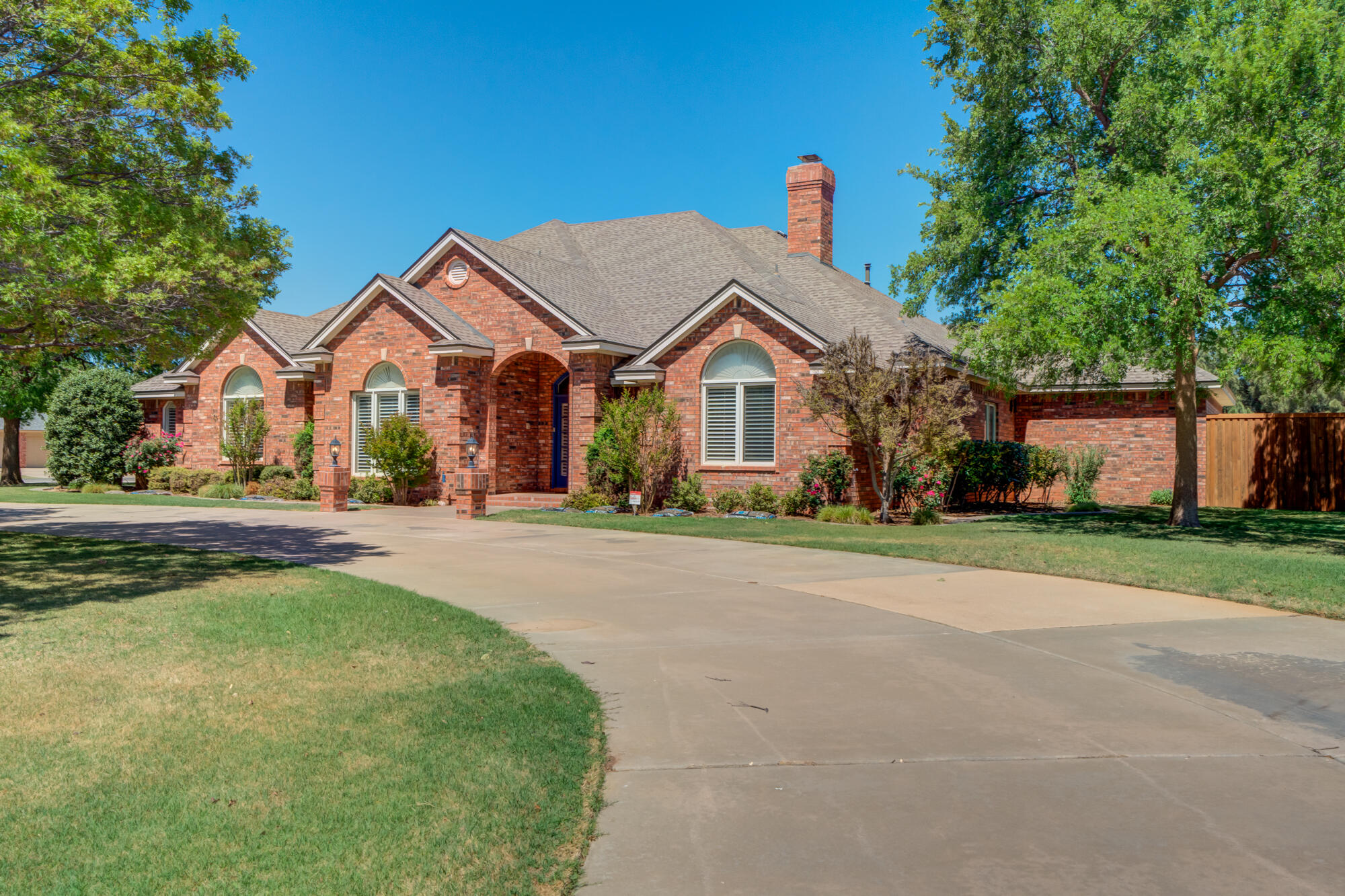 3522 156th Street Lubbock, TX 79423 - Photo 2 of 75 a front view of a house with a garden
