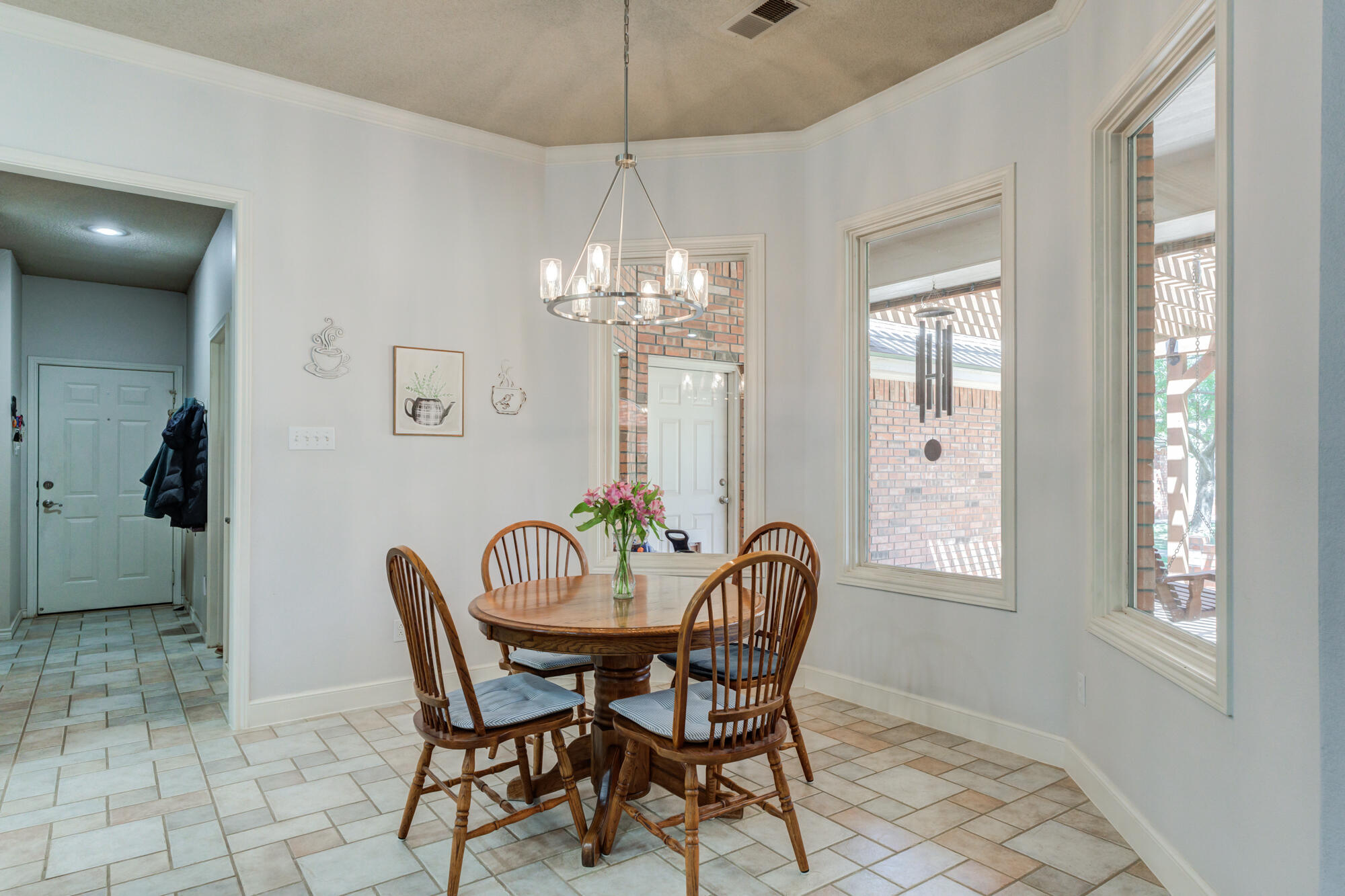 3522 156th Street Lubbock, TX 79423 - Photo 21 of 75 a view of a dining room with furniture and chandelier
