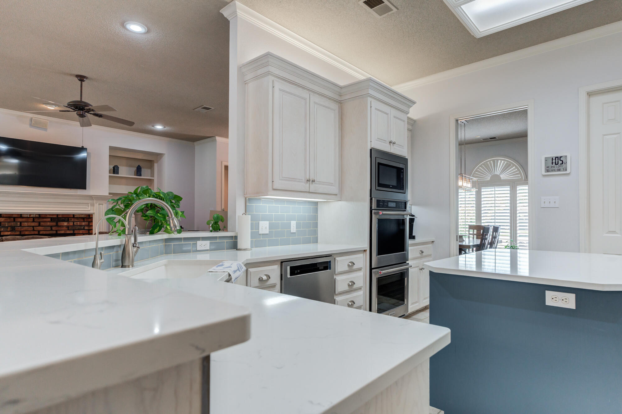 3522 156th Street Lubbock, TX 79423 - Photo 24 of 75 a kitchen with stainless steel appliances a sink a stove and cabinets