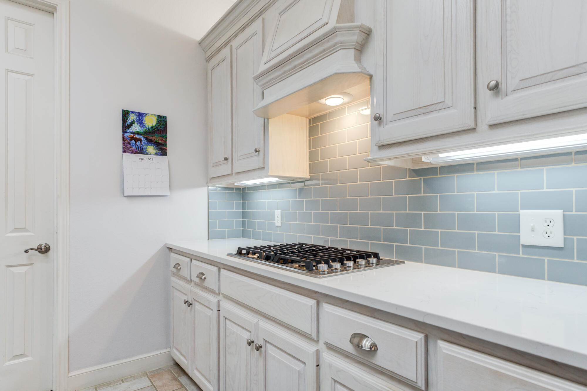 3522 156th Street Lubbock, TX 79423 - Photo 26 of 75 a kitchen with a stove and cabinets