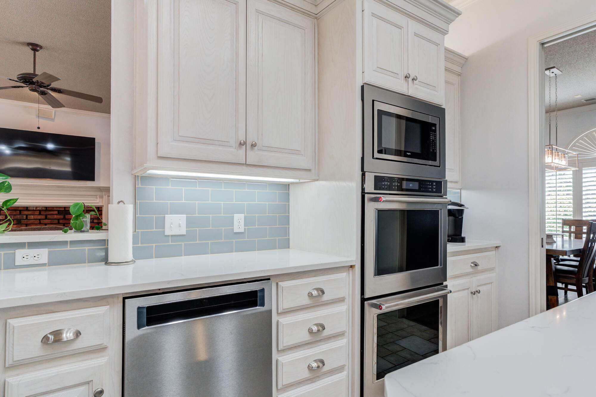 3522 156th Street Lubbock, TX 79423 - Photo 27 of 75 a kitchen with stainless steel appliances white cabinets and stove top oven