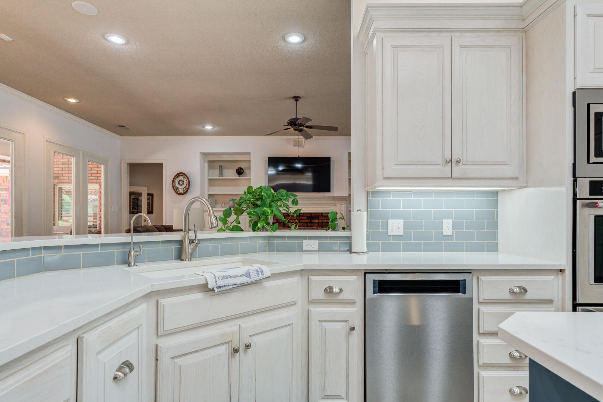 3522 156th Street Lubbock, TX 79423 - Photo 28 of 75 a kitchen with stainless steel appliances granite countertop a sink and cabinets