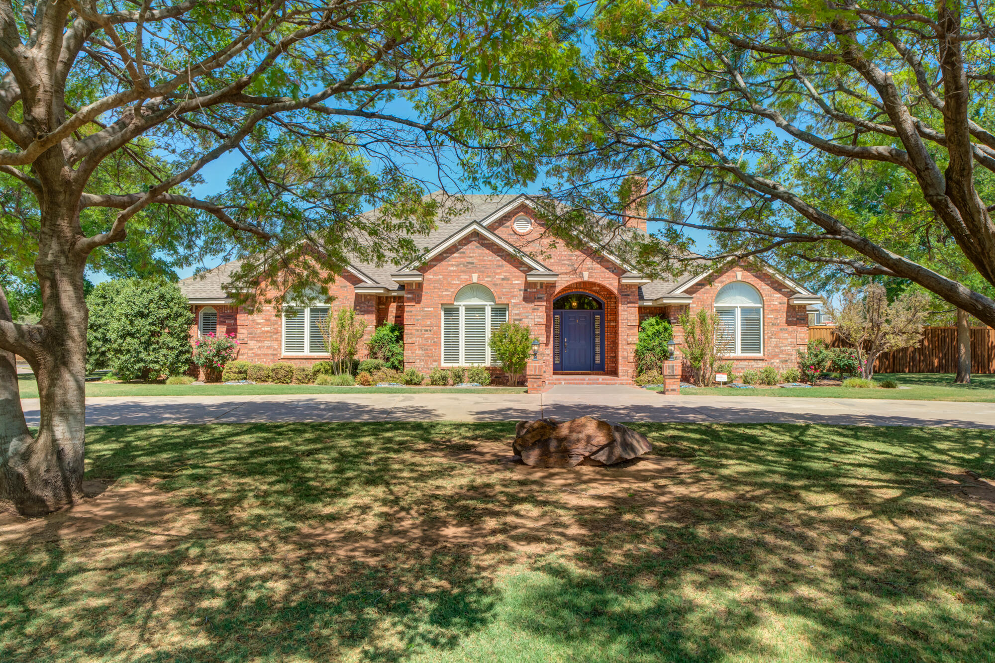 3522 156th Street Lubbock, TX 79423 - Photo 3 of 75 a front view of a house with a garden