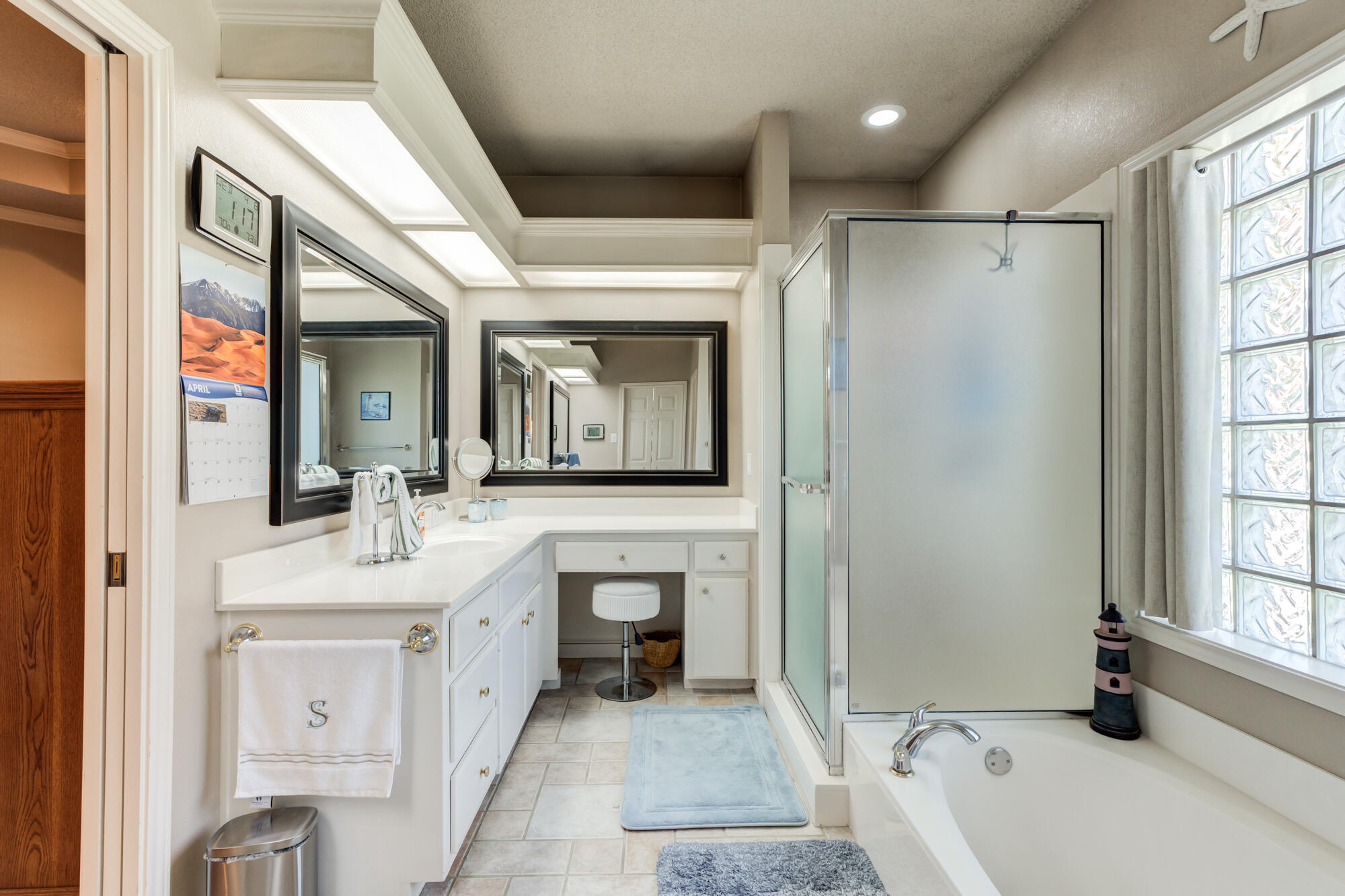 3522 156th Street Lubbock, TX 79423 - Photo 36 of 75 a bathroom with a double vanity sink mirror and bathtub