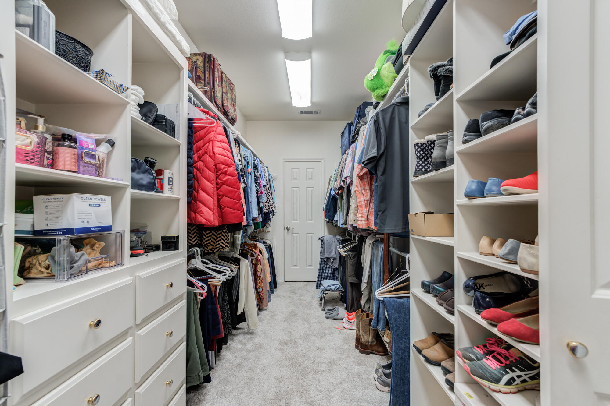 3522 156th Street Lubbock, TX 79423 - Photo 37 of 75 a view of walk in closet with clothes and shoes