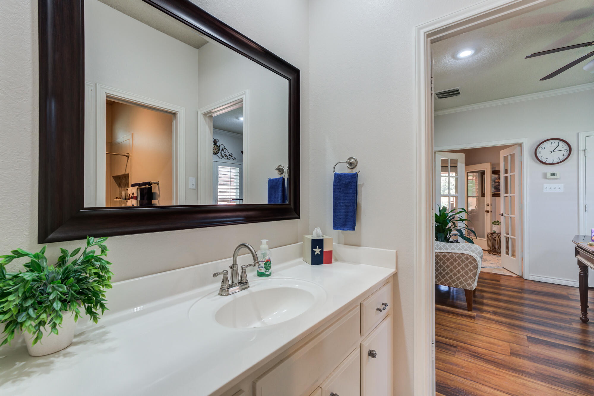 3522 156th Street Lubbock, TX 79423 - Photo 42 of 75 a en suite bathroom with a granite countertop sink and a mirror