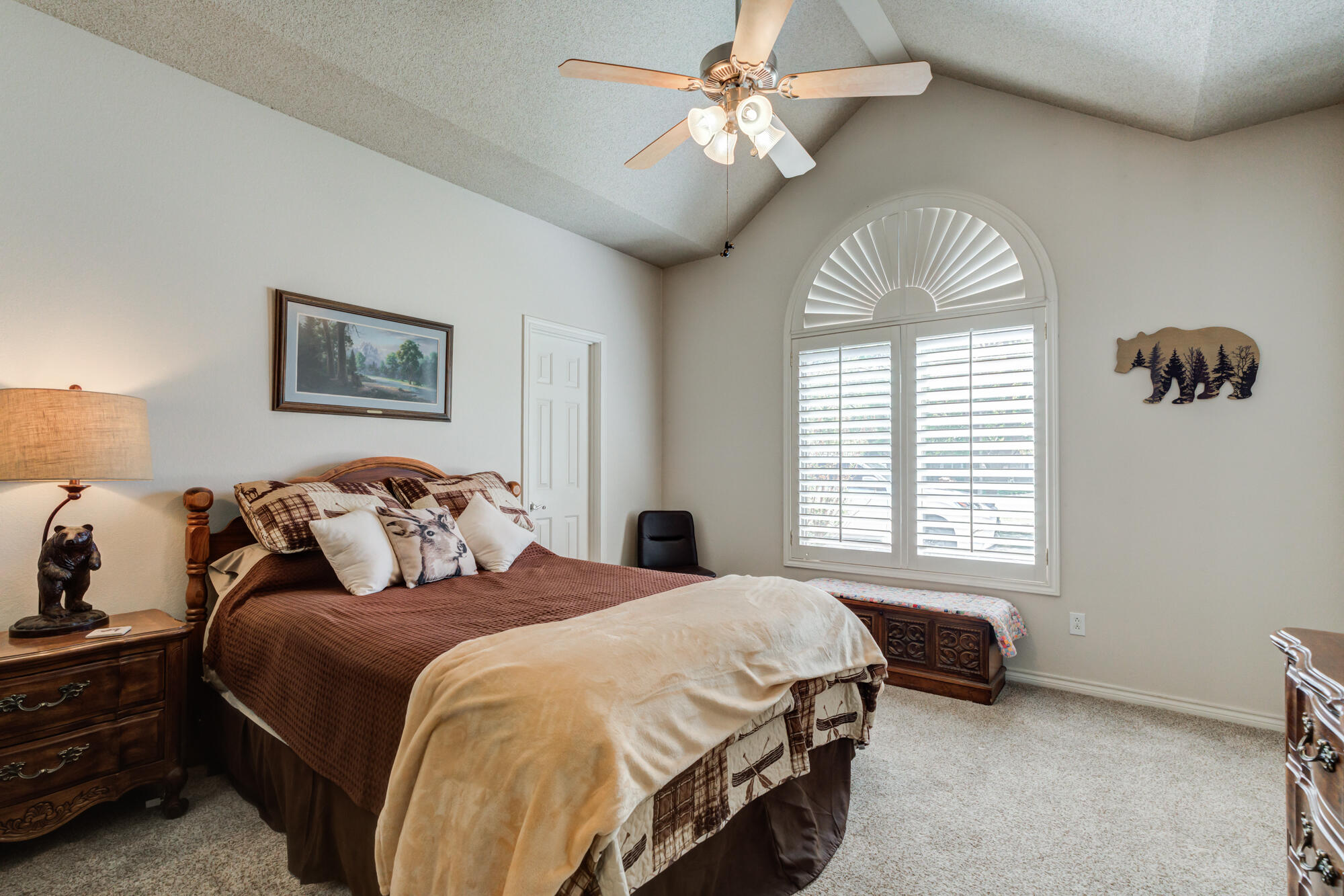 3522 156th Street Lubbock, TX 79423 - Photo 46 of 75 a spacious bedroom with a bed and a chandelier