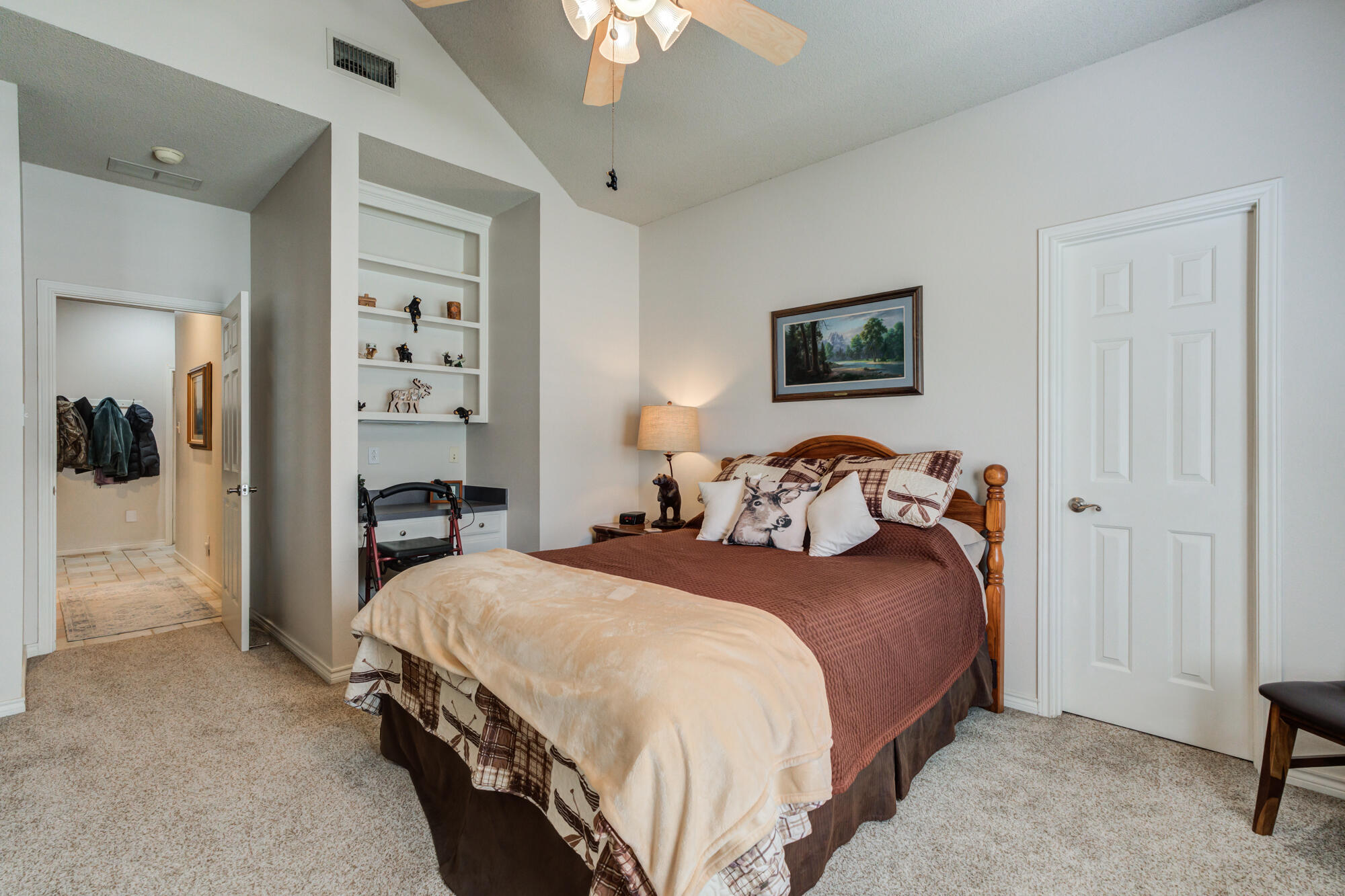 3522 156th Street Lubbock, TX 79423 - Photo 47 of 75 a bedroom with a bed and a chandelier