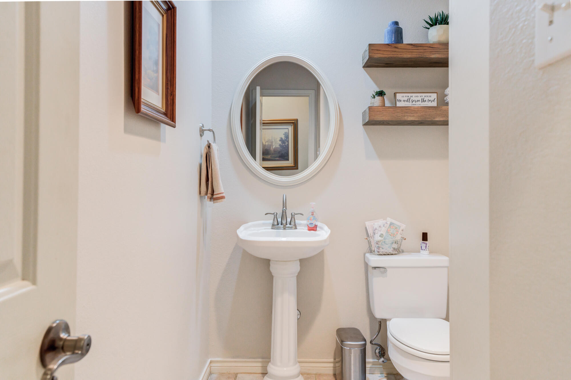 3522 156th Street Lubbock, TX 79423 - Photo 57 of 75 a bathroom with a toilet a sink and a mirror