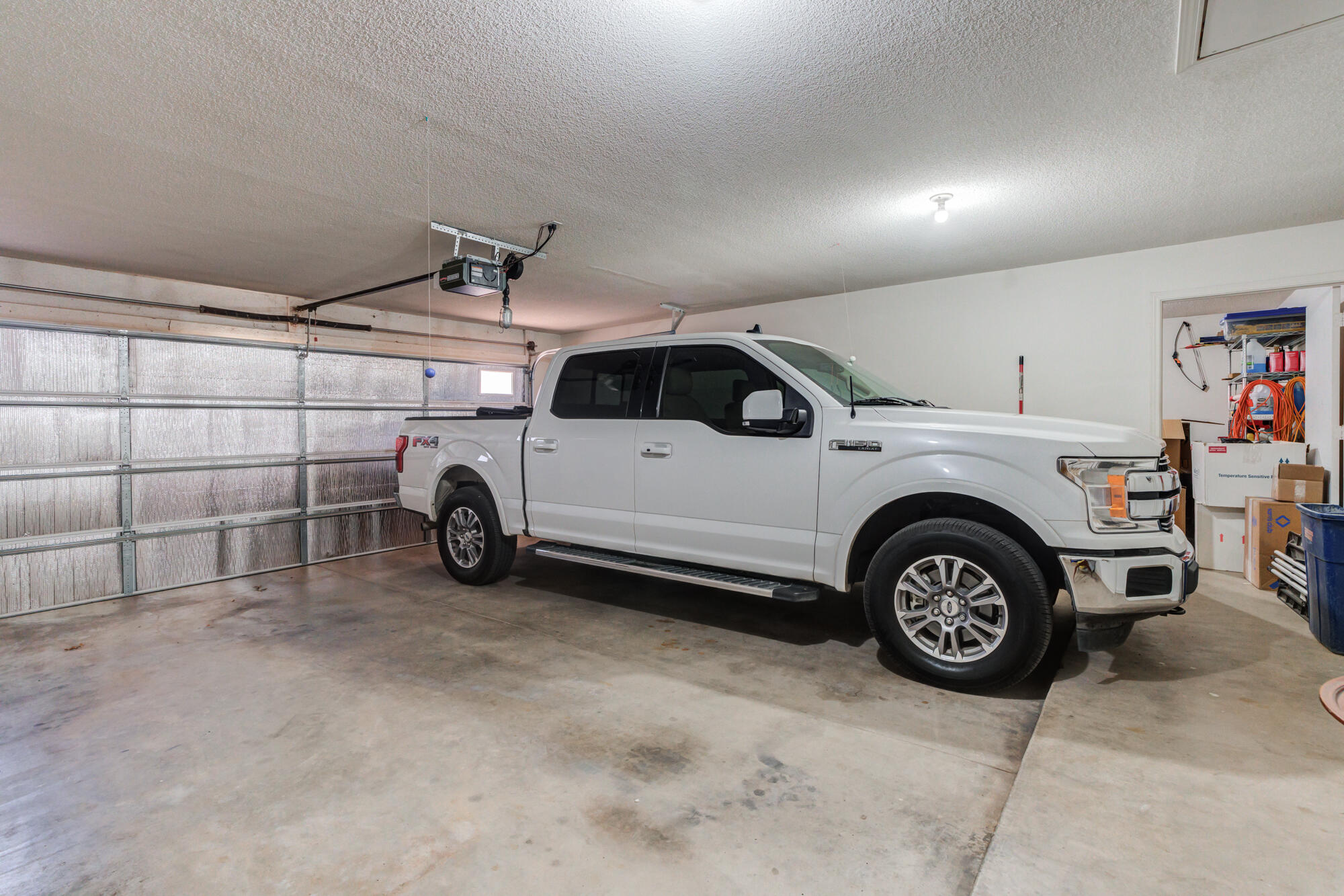 3522 156th Street Lubbock, TX 79423 - Photo 58 of 75 a view of a car in a garage