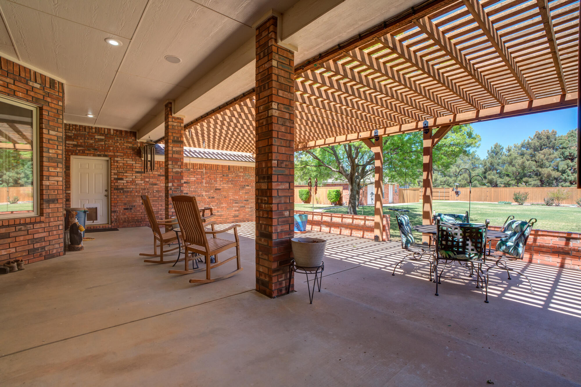 3522 156th Street Lubbock, TX 79423 - Photo 61 of 75 a view of a porch with chairs and backyard