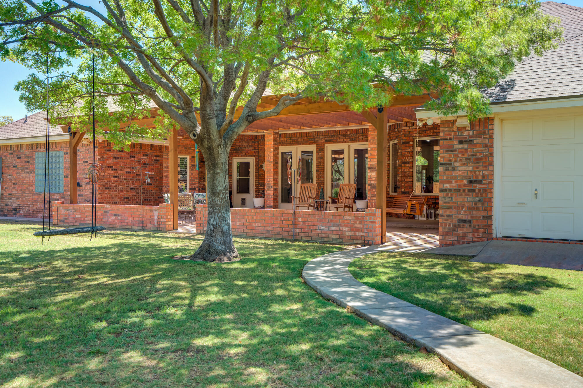 3522 156th Street Lubbock, TX 79423 - Photo 64 of 75 Brick border separates the Patio