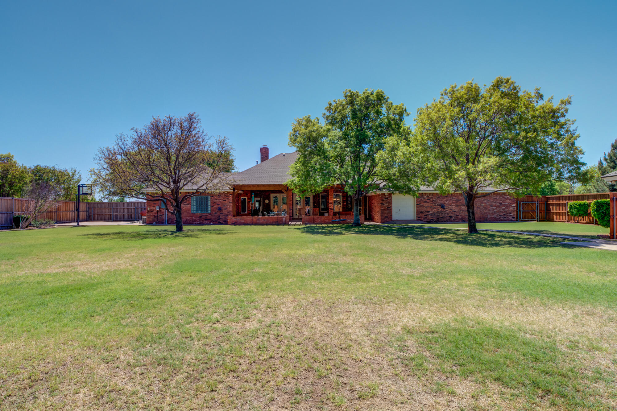 3522 156th Street Lubbock, TX 79423 - Photo 67 of 75 a view of a house with a backyard