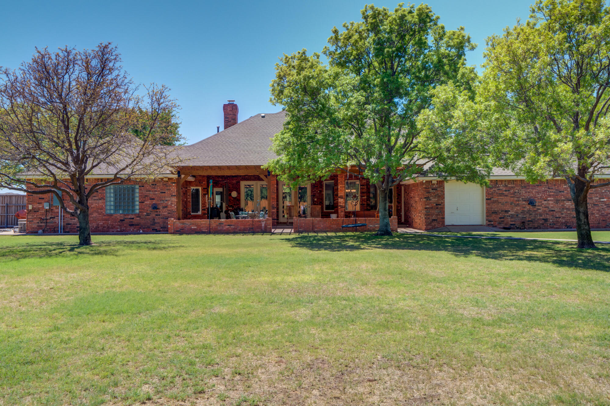 3522 156th Street Lubbock, TX 79423 - Photo 69 of 75 a front view of a house with a garden