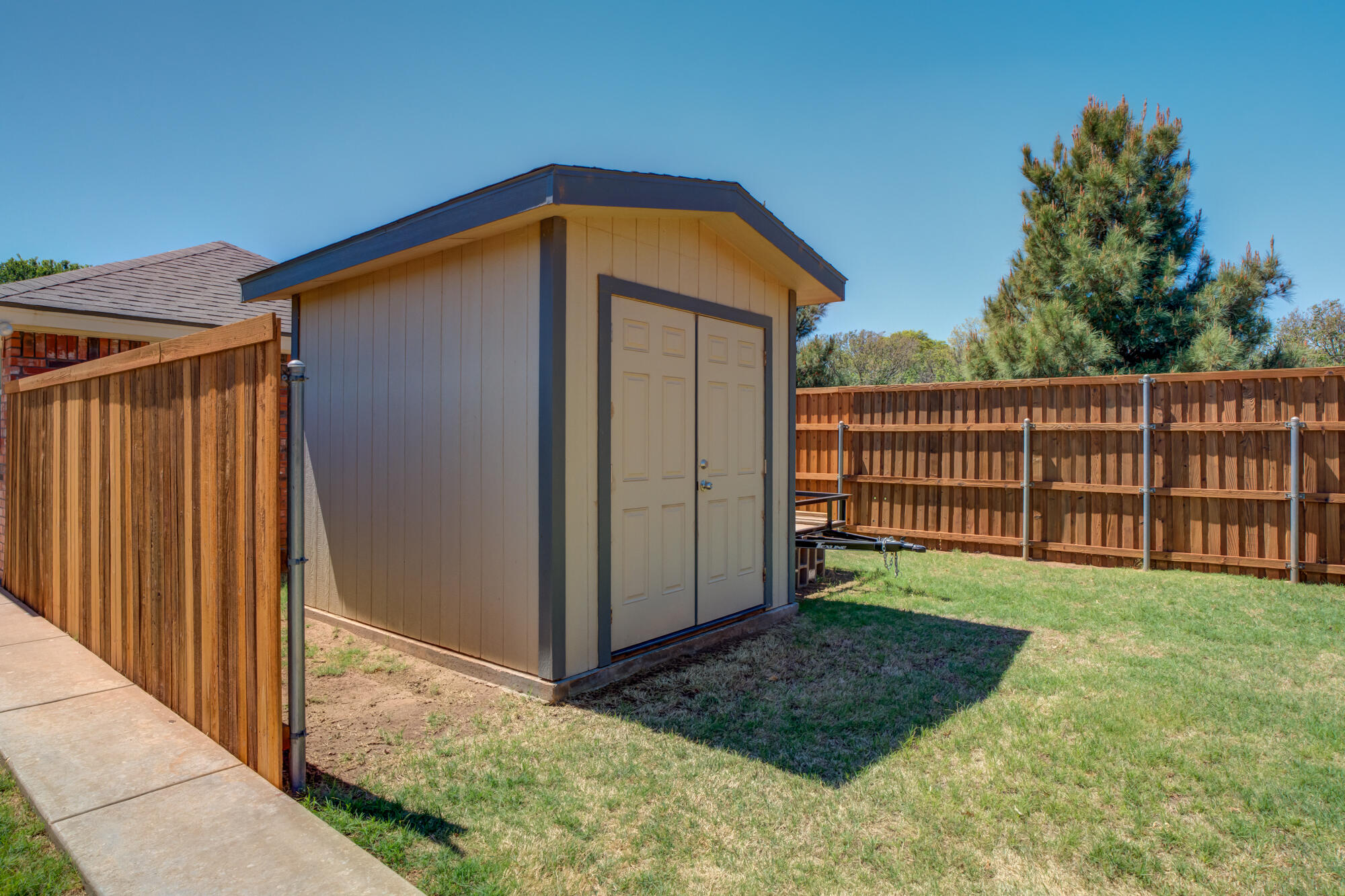 3522 156th Street Lubbock, TX 79423 - Photo 72 of 75 a view of a backyard with wooden fence