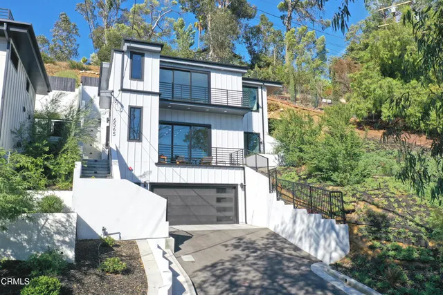 a view of a patio with table and chairs and potted plants