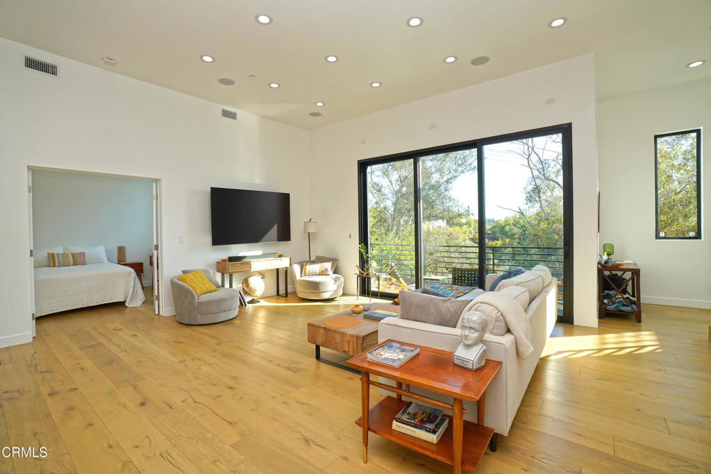6565 Pickwick Street Los Angeles, CA 90042 - Photo 16 of 41 a living room with furniture and a flat screen tv