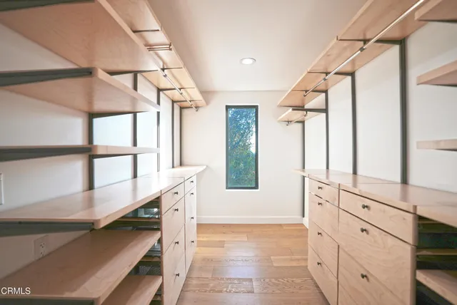 a view of a walk in closet and bedroom